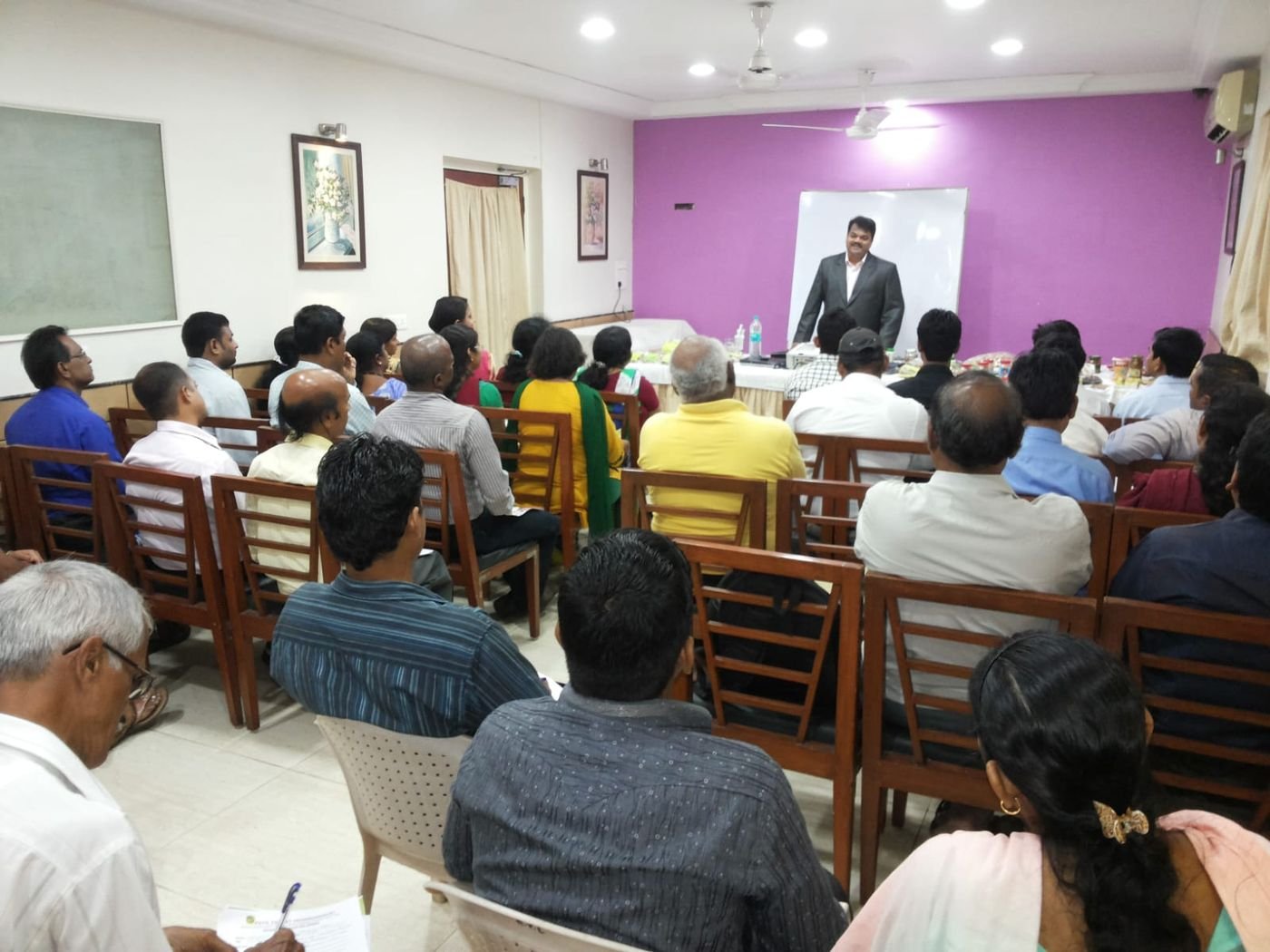 Founder addressing a training session